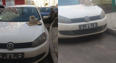 Pentru că a parcat neregulamentar în faţa blocului, acest şofer s-a trezit fără plăcuţe, dar şi cu o piatră pe capotă - Photo