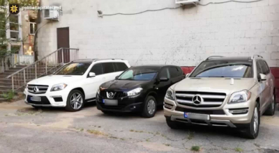 (VIDEO) Escrocherie cu vânzarea mașinilor de lux gestionată din pușcărie! Poliția a reținut o întreagă grupare criminală - Photo