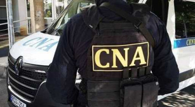 Ofițer de patrulare reținut de CNA după ce a cerut mită de la un șofer. În mașina acestuia au fost găsiți 4.000 de lei - Photo